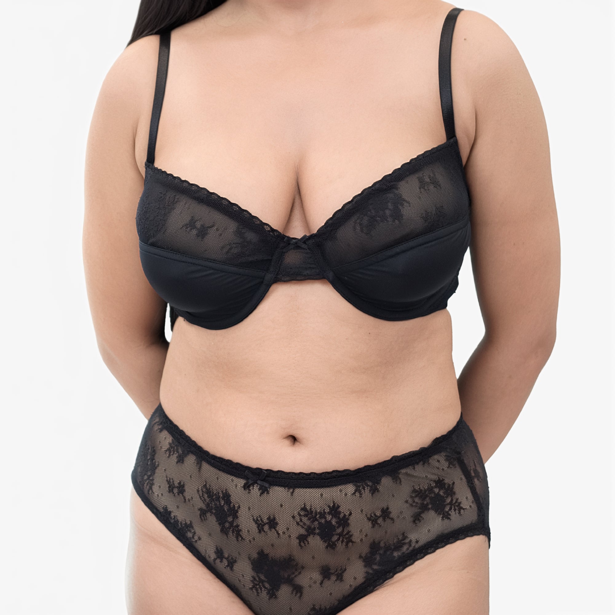 Black lace lingerie set on a plain background