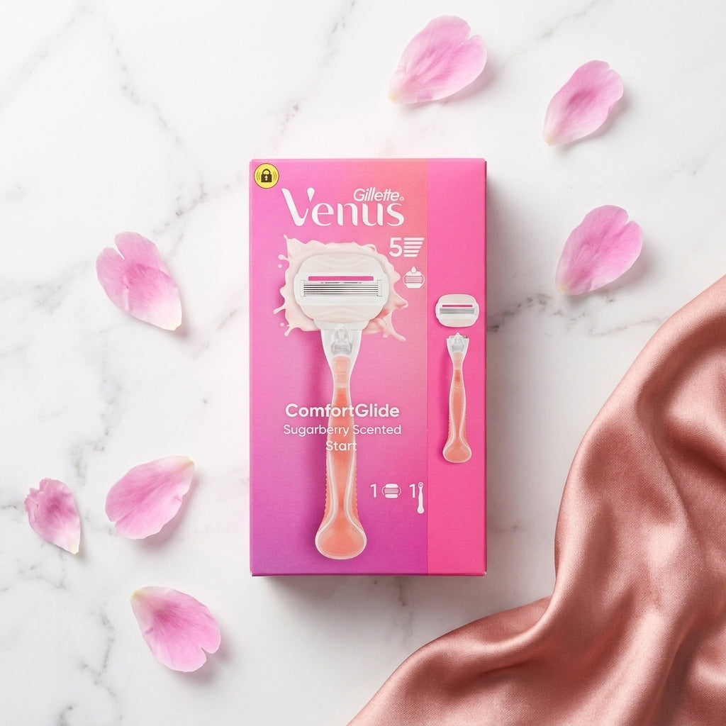 Gillette Venus razor packaging with pink petals on a marble background